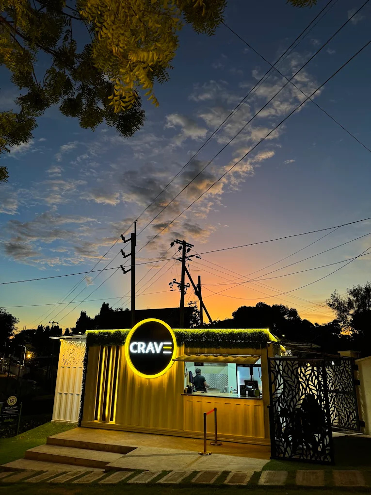 Crave storefront at dusk